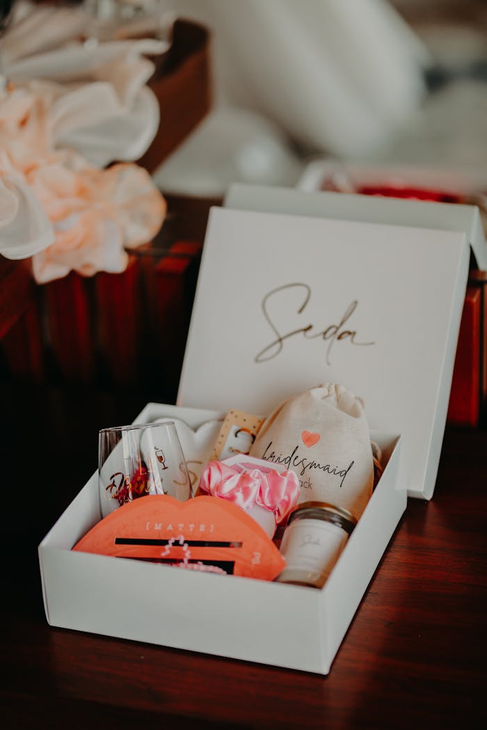 Services Close-up of a beautifully arranged bridesmaid gift box featuring personalized items and thoughtful details.